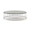 A chic coffee table with a stainless steel frame and a green marble surface