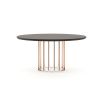 A luxurious oak table with an art deco-inspired copper base 