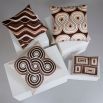 Cushion with shades of brown abstract wave artwork