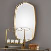 A gorgeous wall mirror by Uttermost with a golf leaf finish