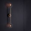 Retro natural brass wall lamp with clear glass globes