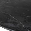 Black marble dining table with timeless oval silhouette