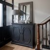 Bold black cabinet with statement panelling on the doors