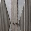 Rustic tall cabinet with ribbed diamond pattern on the doors