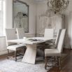 Illustrious dining table with geometric shape legs and washed wood finish