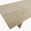 Illustrious dining table with geometric shape legs and washed wood finish