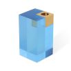 A glamorous candleholder by Jonathan Adler featuring a blue acrylic block fitted with a solid brass candleholder