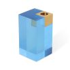 A glamorous candleholder by Jonathan Adler featuring a blue acrylic block fitted with a solid brass candleholder