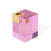 A luxuriously glamorous candleholder by Jonathan Adler with a solid pink acrylic block fitted with a solid brass corner candleholder
