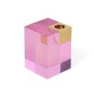 A luxuriously glamorous candleholder by Jonathan Adler with a solid pink acrylic block fitted with a solid brass corner candleholder