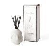 A contemporary glossy white fragranced room diffuser by Jonathan Adler