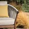 Modern and sleek outdoor dining chair with woven backrest