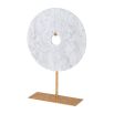 white marble disk elegantly displayed on a gold stand