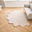luxuriously cosy shell-shaped sheepskin rug