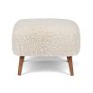 Cosy footrest upholstered in soft sheepskin