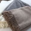 Cosy wool throws in various colour finishes