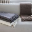 Cosy wool throws in various colour finishes