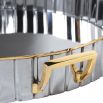 A glamorous tray crafted from stainless steel with a ribbed design and finished with gold handles 
