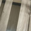Polished stainless steel coffee table with tempered clear glass surface