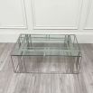 Polished stainless steel coffee table with tempered clear glass surface