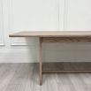 Wooden dining table with shaped underframe