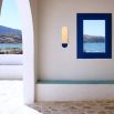 A luxury, large wall light by Schwung with a Santorini Blue finish and glass opal shade