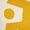 Square cushion with yellow abstract artwork