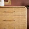Wooden chest of eight drawers with a rounded silhouette