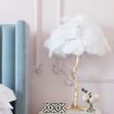 Mini ostrich feather lamp in white with a gold base