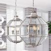 A large luxury lantern by Eichholtz with a bevelled glass and nickel finish 