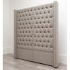 An extravagant deep buttoned headboard