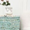 Mediterranean style stool in turquoise capiz finish