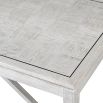 A beautiful white oak coffee table with contrasting, dark metal accents