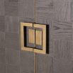 A luxurious wardrobe with a brown oak finish and antique brass hardware