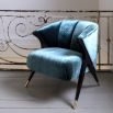 Designer luxury armchair upholstered in Aegean green crushed velvet with black/brass legs