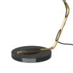 Lamp with antique brass arm fixed to a circular, black marble base