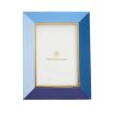 A tonal blue leather picture frame by Jonathan Adler with a glamorous polished brass inner edge