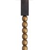 Floor lamp with blocks of ebonised mango wood that border a totem of antique brass spheres