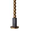 Floor lamp with blocks of ebonised mango wood that border a totem of antique brass spheres
