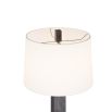 Floor lamp with blocks of ebonised mango wood that border a totem of antique brass spheres