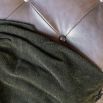 Green wool throw with tassles and shimmered finish