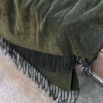 Green wool throw with tassles and shimmered finish