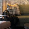 Green wool throw with tassles and shimmered finish