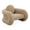 The Pompidou Lounge Chair is a deep, cozy cocoon with a tubular framework, upholstered in Valais Latte bouclé for ultimate comfort.