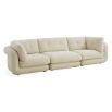 Curvaceous boucle cream three seater sofa with deep buttoning detail on backrest