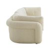 Curvaceous boucle cream three seater sofa with deep buttoning detail on backrest