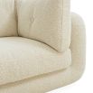 Curvaceous boucle cream three seater sofa with deep buttoning detail on backrest