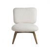A luxurious faux shearling armchair with natural oak frame