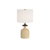Tulip shaped faux travertine lamp in neutral sand shade