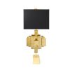 A luxurious sculptural side lamp with layers of solid brass and black lampshade